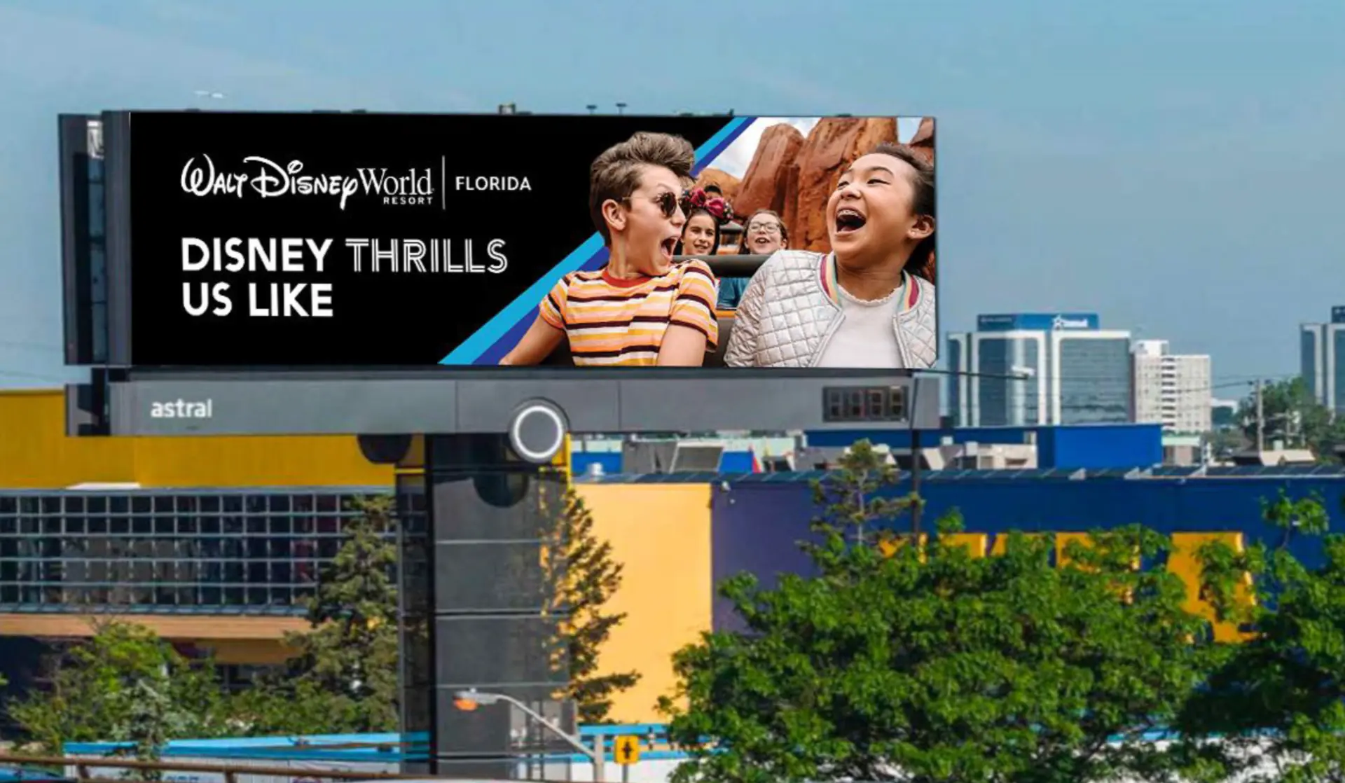 Disney Thrills billboard execution with the four-park color bar